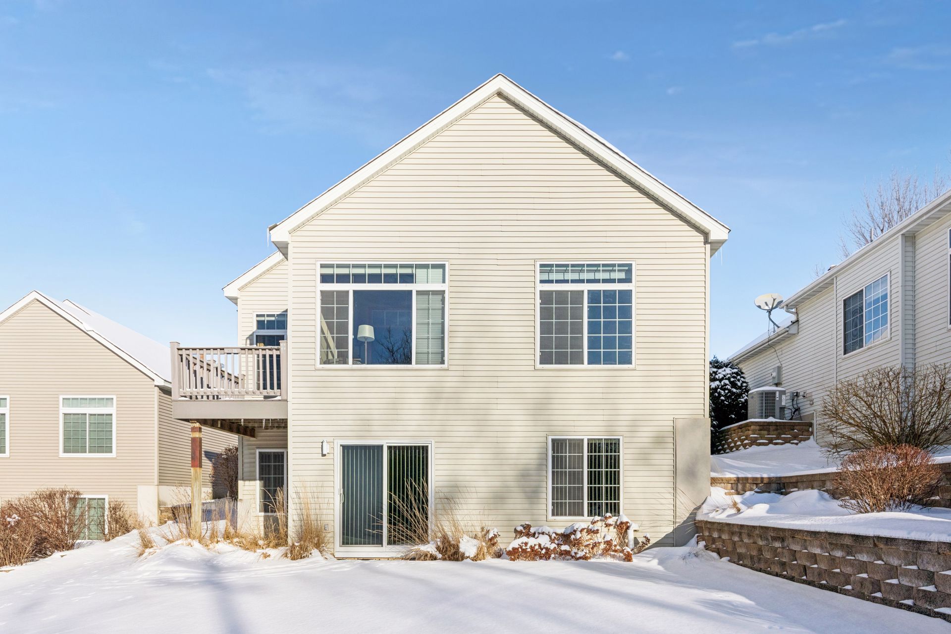 Rear exterior of Townhome showing the very large windows